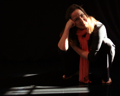 Director and choreographer, Sarah Morrison, reflects in her favorite sun spot in the MorrisonDance rehearsal studio located in the Ohio City neighborhood of Cleveland, OH.